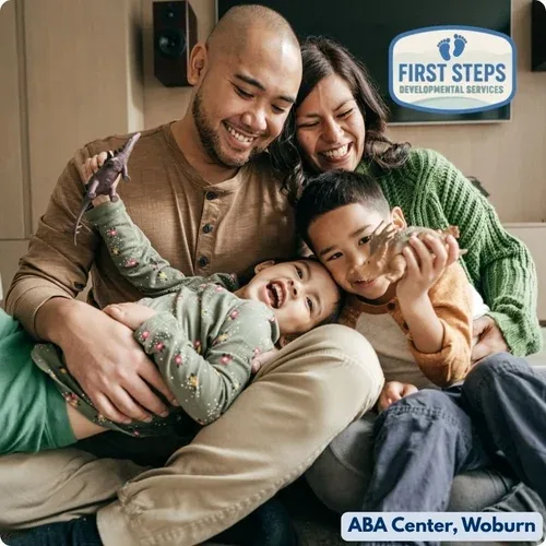 Family collaborating with the First Steps ABA therapy team to plan individualized support, reflecting the ongoing partnership at the heart of caregiver coaching in Woburn.