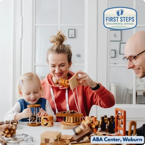 Mother and child engaging with developmental toys at First Steps Developmental Services, promoting caregiver involvement and child learning in a supportive environment.